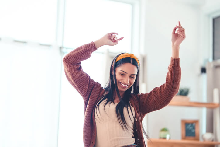 A woman celebrates her license reinstatement.