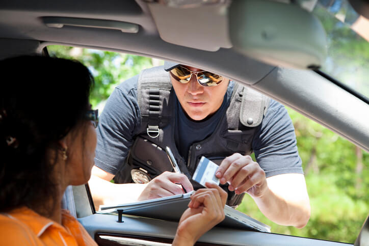 A police officer writing a Washington traffic ticket