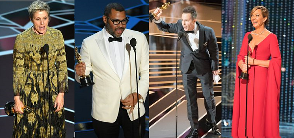 Four oscar winners giving speeches and holding up their awards.